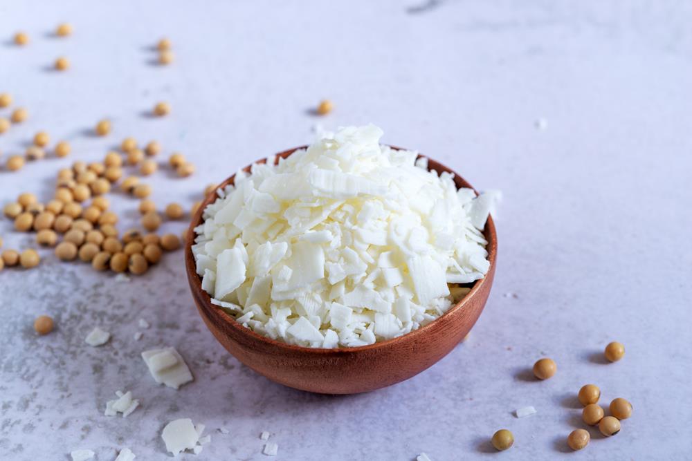 Natural soy wax in a wooden bowl