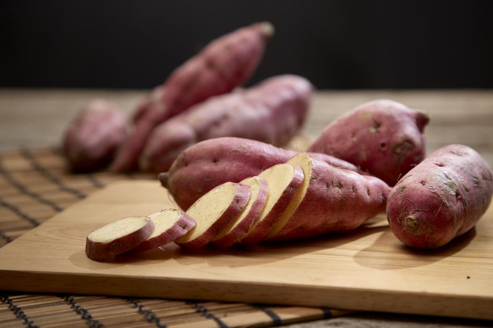 Sweet potatoes on a cutting board