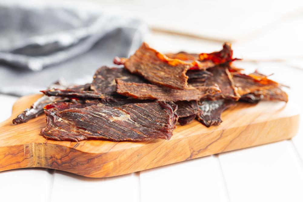 Beef jerky on a cutting board