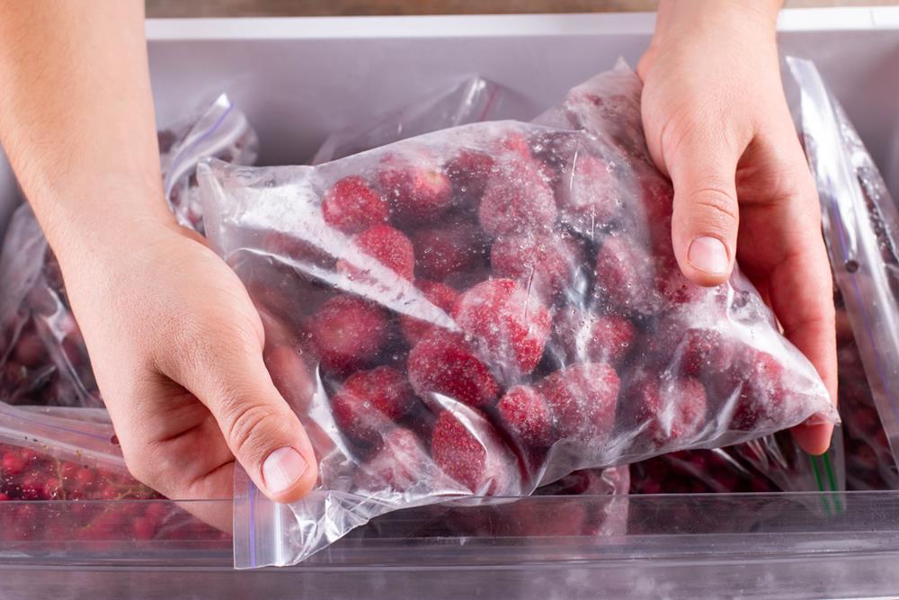 Frozen strawberries in a plastic bag