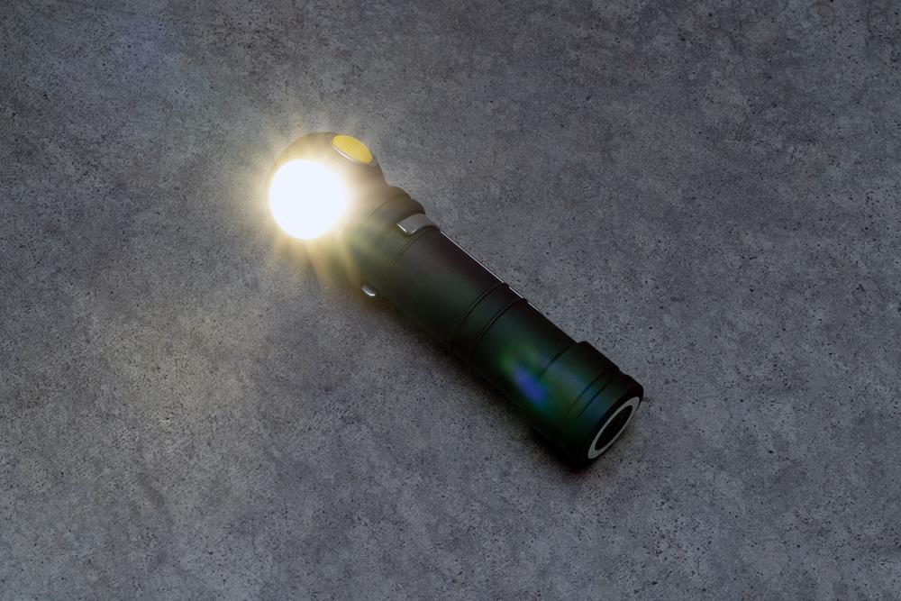 Flashlight on a gray desk