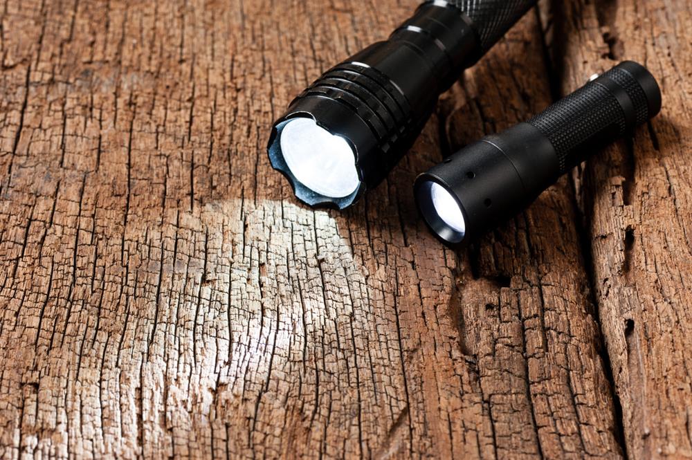 Two small flashlights on a table