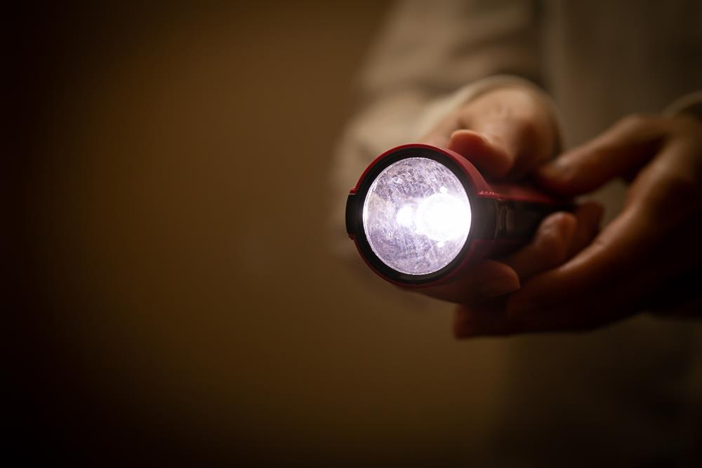 Person using a flashlight