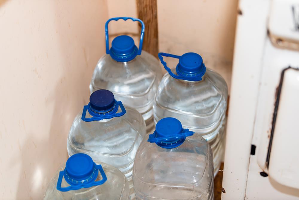 Water stored in plastic jugs