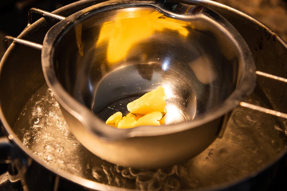 Candle wax being melted in a double boiler