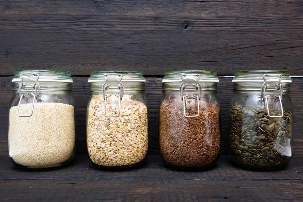 Different grains and seeds in containers