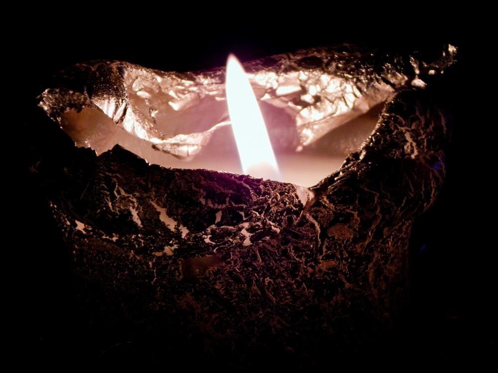 Candle wrapped in aluminum foil