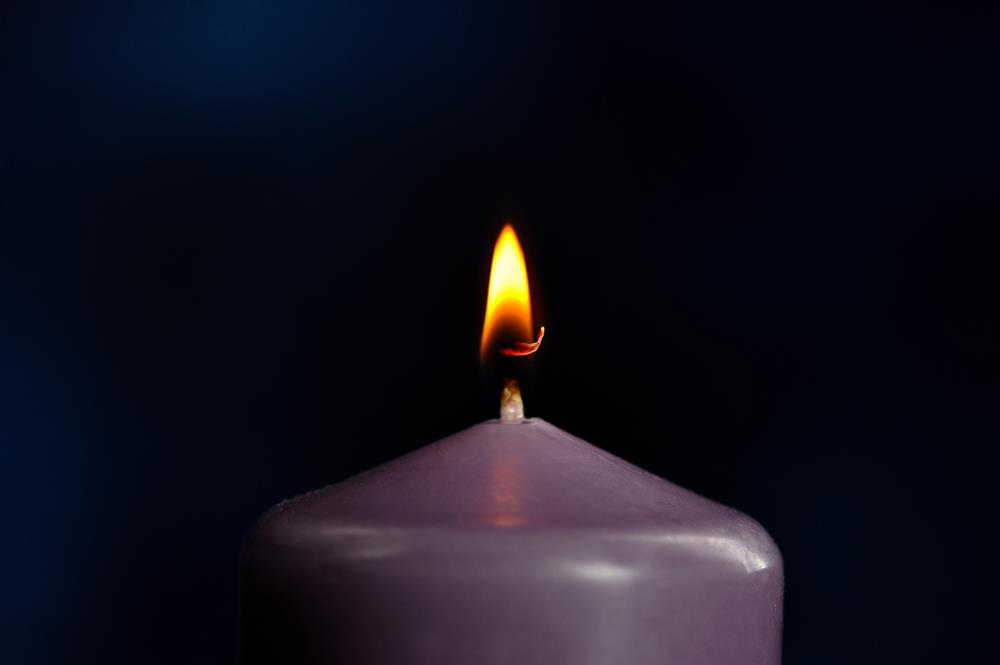 Burning a purple candle