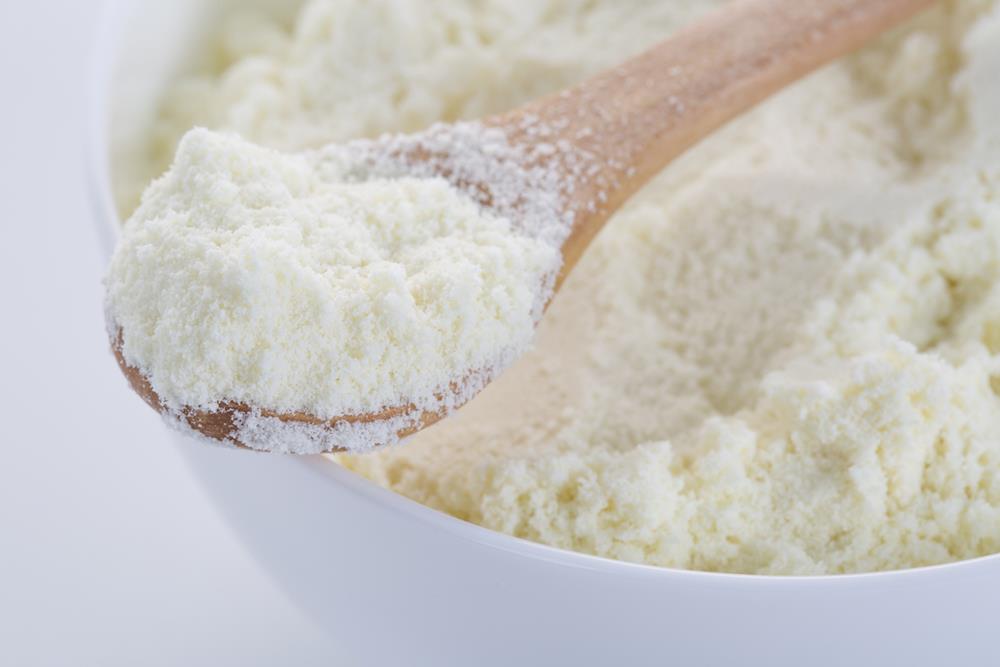 Freeze dried milk on a wooden spoon