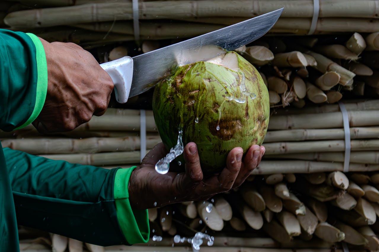 Man Cutting Coconut