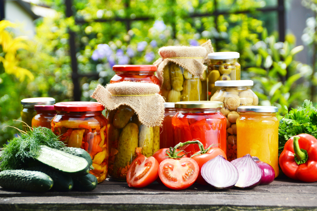 Jars of pickled vegetables in the garden