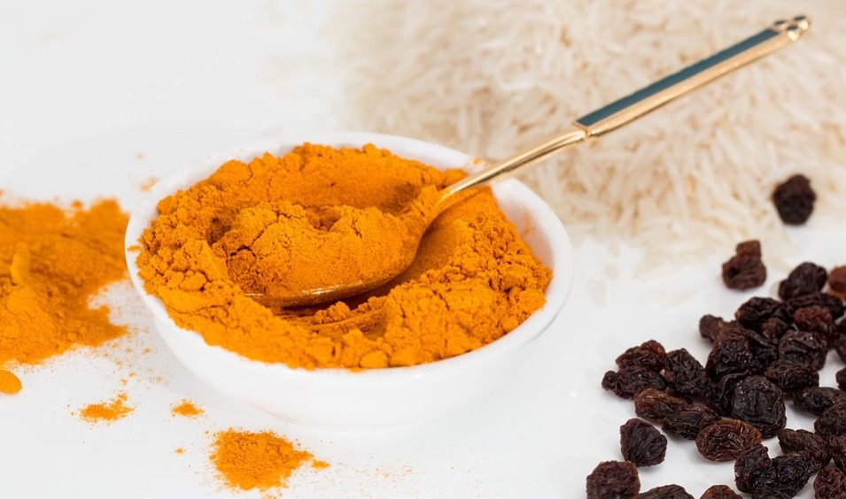 turmeric spice in a small white dish