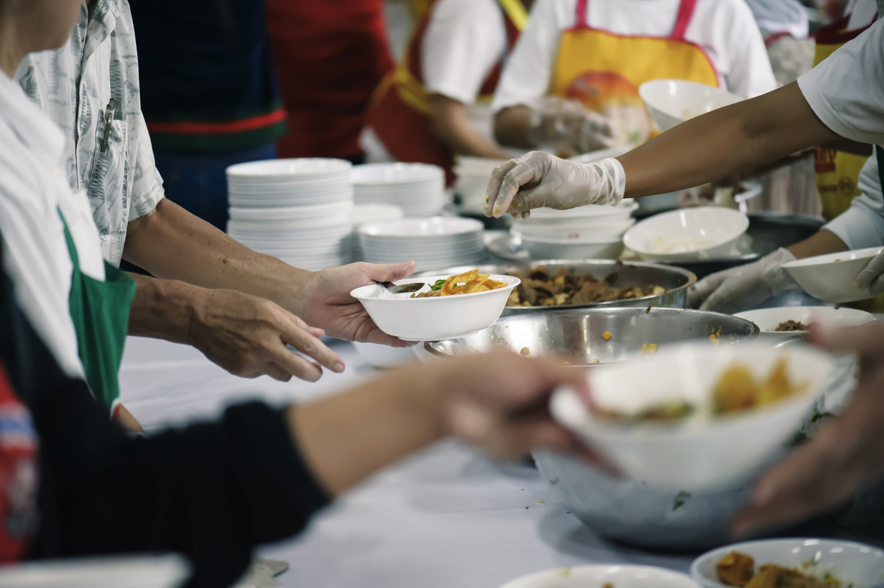 Volunteers Share Food to the Poor to Relieve Hunger