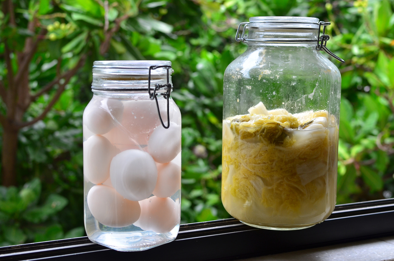 Pickled cabbage and Salty eggs in a glass jar