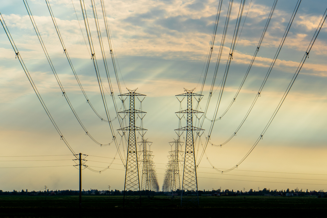 High voltage transmission line at sunset