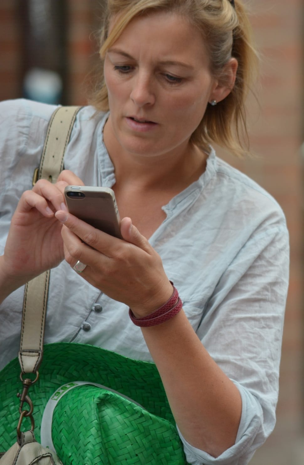 A mom using a smartphone to contact her family