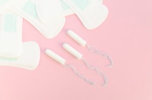 Halves of pads and tampons on pin