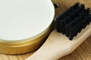 Closeup of shoe brush and polish