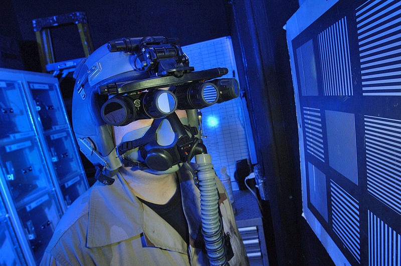A man wearing helmet and night vision goggles