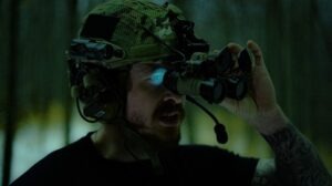 Man wearing a helmet with night vision binoculars 