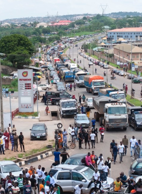 crowd-of-people-on-a-road-with-heavy-traffic