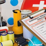 Hand completing Emergency Preparation List by Equipment