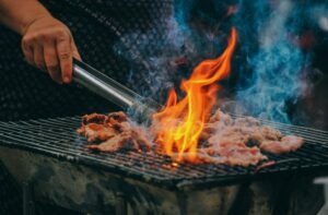 close-up-photo-of-man-cooking-meat